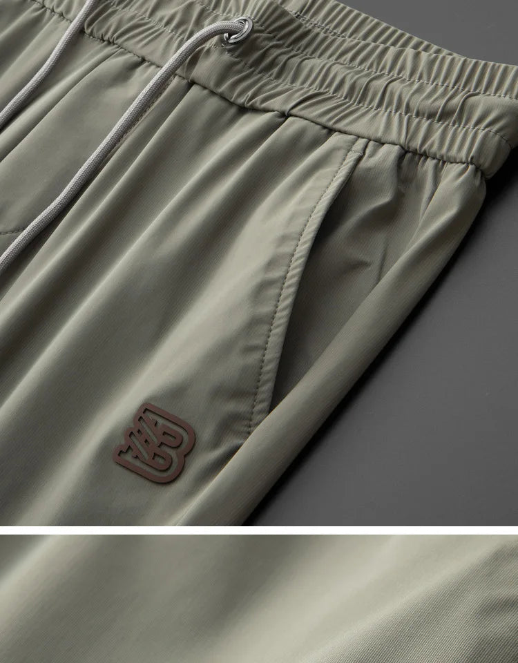 Luxury brand men's letter printed casual pants 2024 summer new ice silk comfortable and breathable casual pocket sports pants